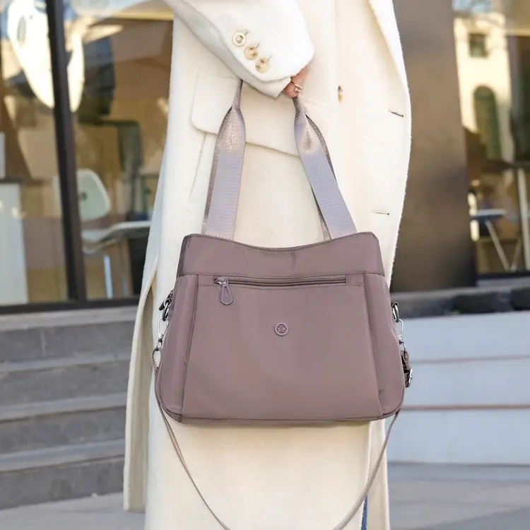 

Модная женская нейлоновая дорожная сумка-тоут 2026 года, водонепроницаемая и повседневная, многофункциональная сумка через плечо для мам