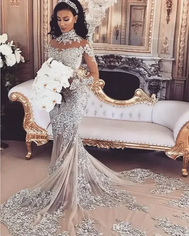 Abito da sposa a sirena personalizzato Perline scintillanti trasparenti sexy Applique in pizzo Collo alto Illusione Manica lunga Champagne Tromba da sposa Go