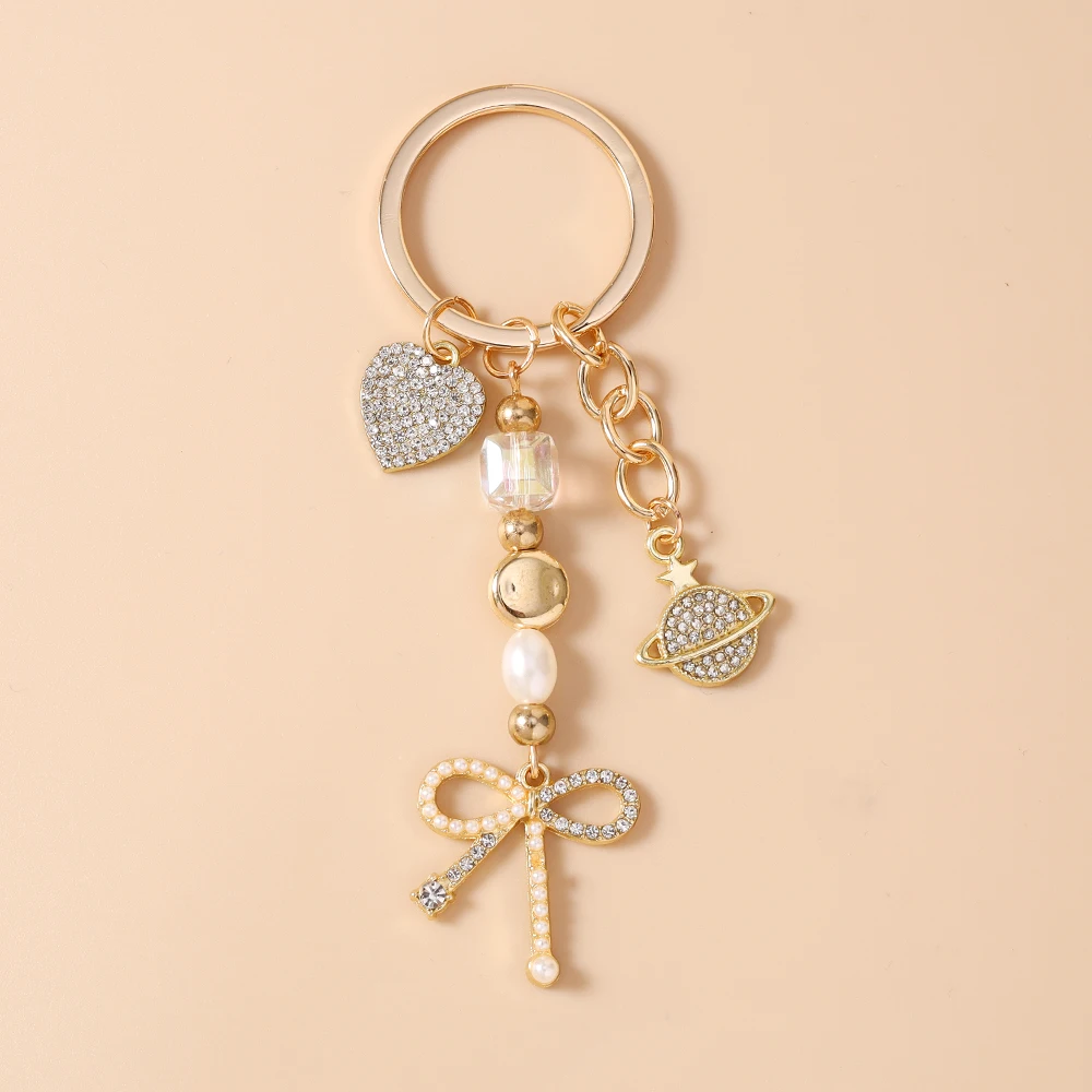 Aihua Exquisiter Schlüsselanhänger in Goldfarbe mit Herz, Stern und Schleife für Damen und Mädchen, Handtaschenanhänger, Dekoration, handgefertigter Schmuck, Geschenke – Detail 3