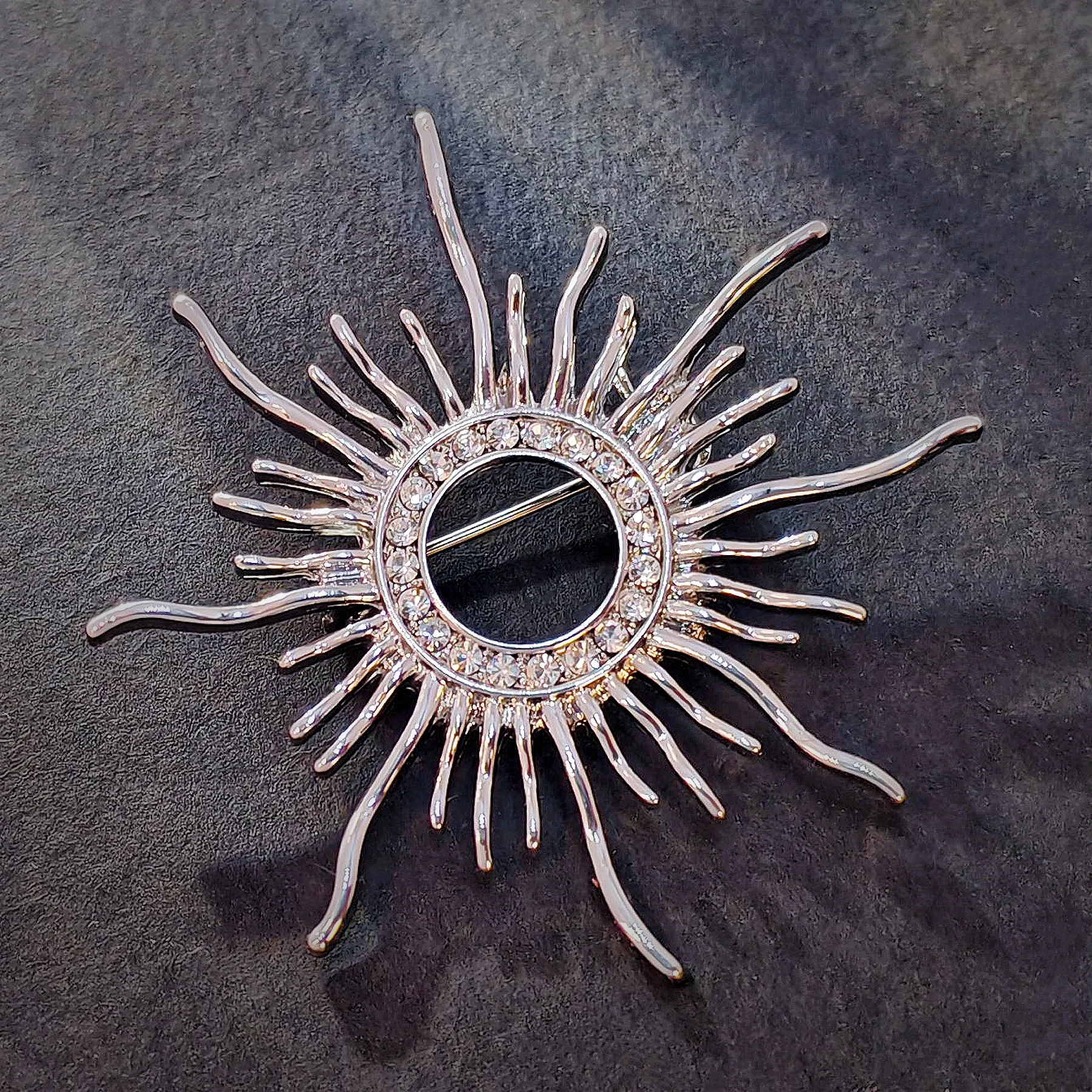 

Classic Opens Silver Metallic Sunburst Pin Brooch with Crystal Accent