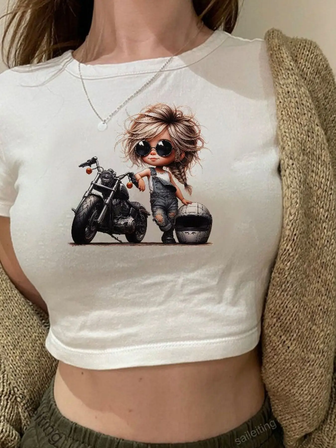Stylish Cartoon Character with Shaggy Blonde Hair and Sunglasses on Motorcycle Crop Top - Short Sleeve Graphic Tee, Silver He