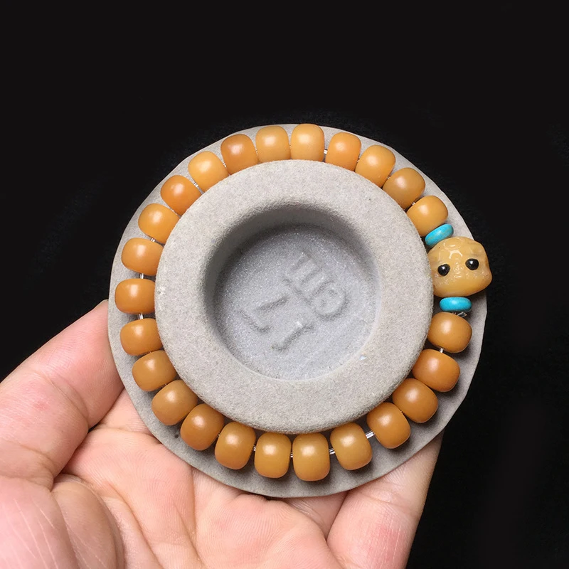 Weathered Barrel Bracelet paired with a single-strand Bodhi Root Carved Bead
