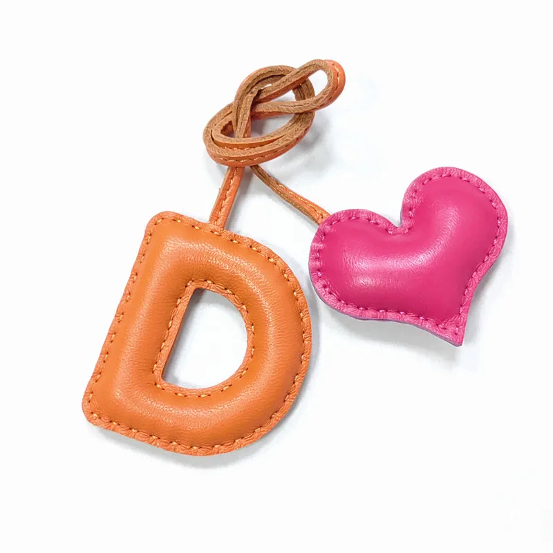 Genuine leather D with heart-shaped letter style bag decoration with pure handmade stitching, high-end car keychain accessories