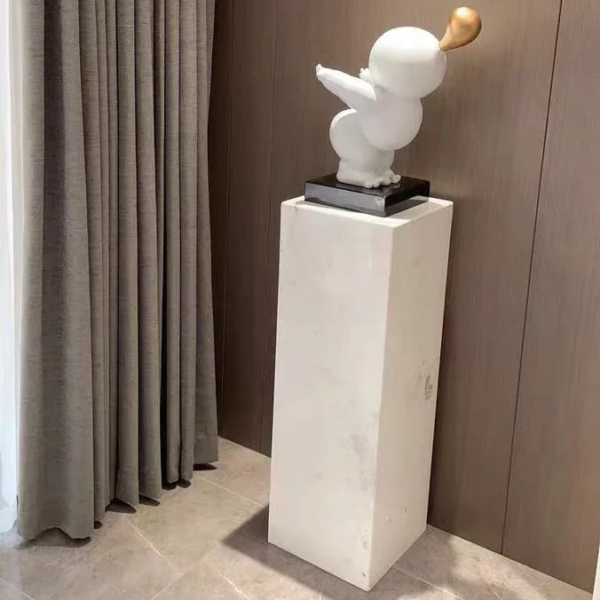 White marble pedestal ornaments Floor-to-floor stone pillar pedestal and stone pier sculpture platform beside the living room