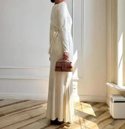 

Autumn 2025 New Round Neck Button Tied Slim Knit Wool Dress for Women Elegant and Casual Slim Fit A-Line Long Sleeved Knit Dress