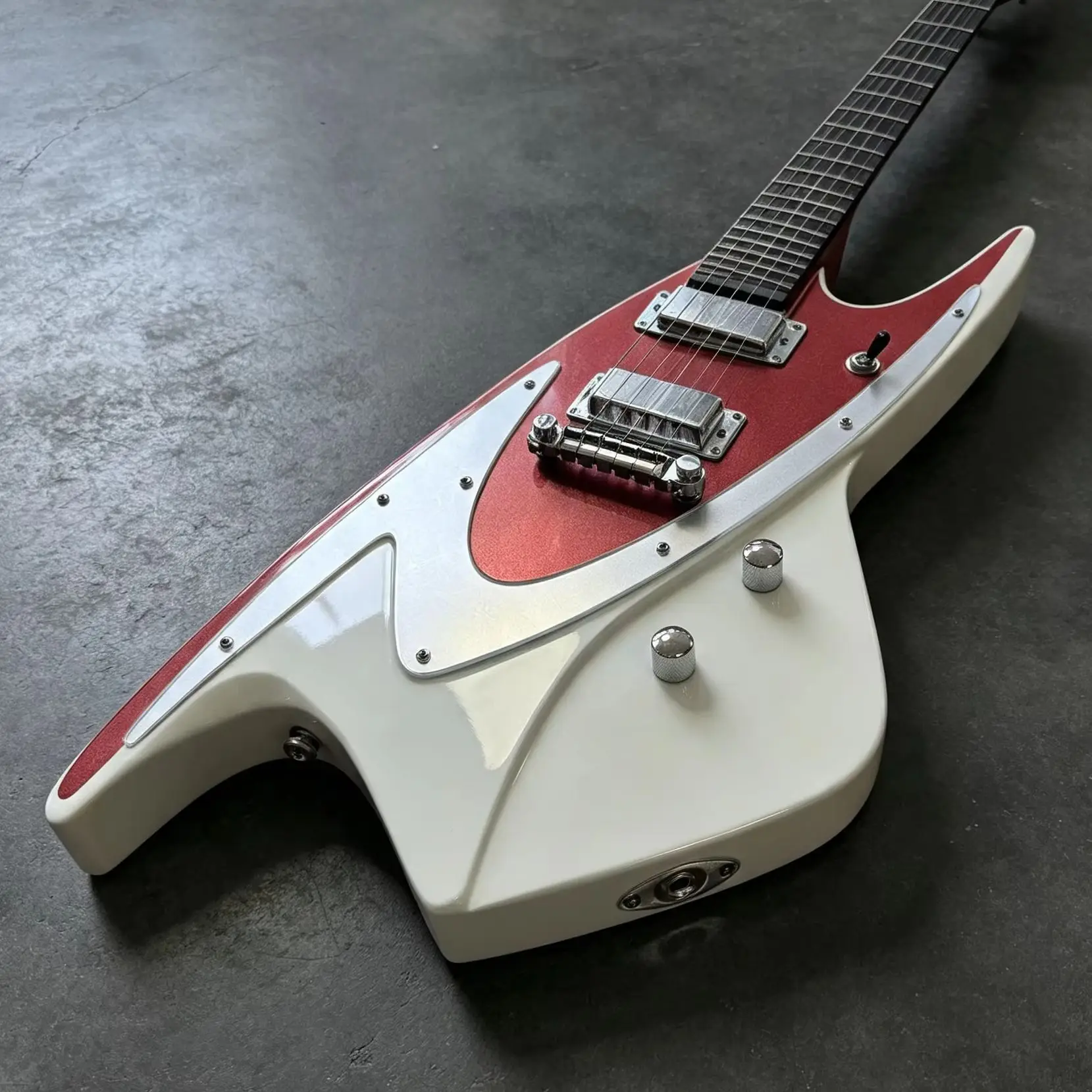 Red And White Contrasting Electric Guitar Shark Fin Design High Recognition Value Space Age Aesthetics Future Retro Style