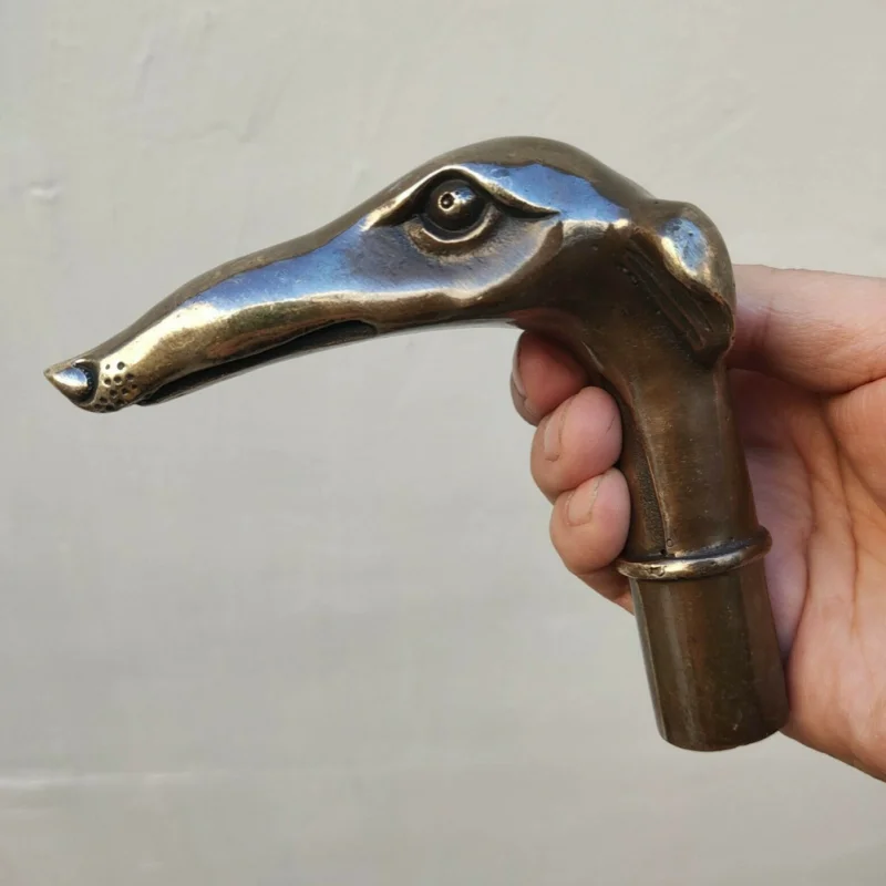 

Antique Walking Stick with Bronze Gun Head Holding Dog
