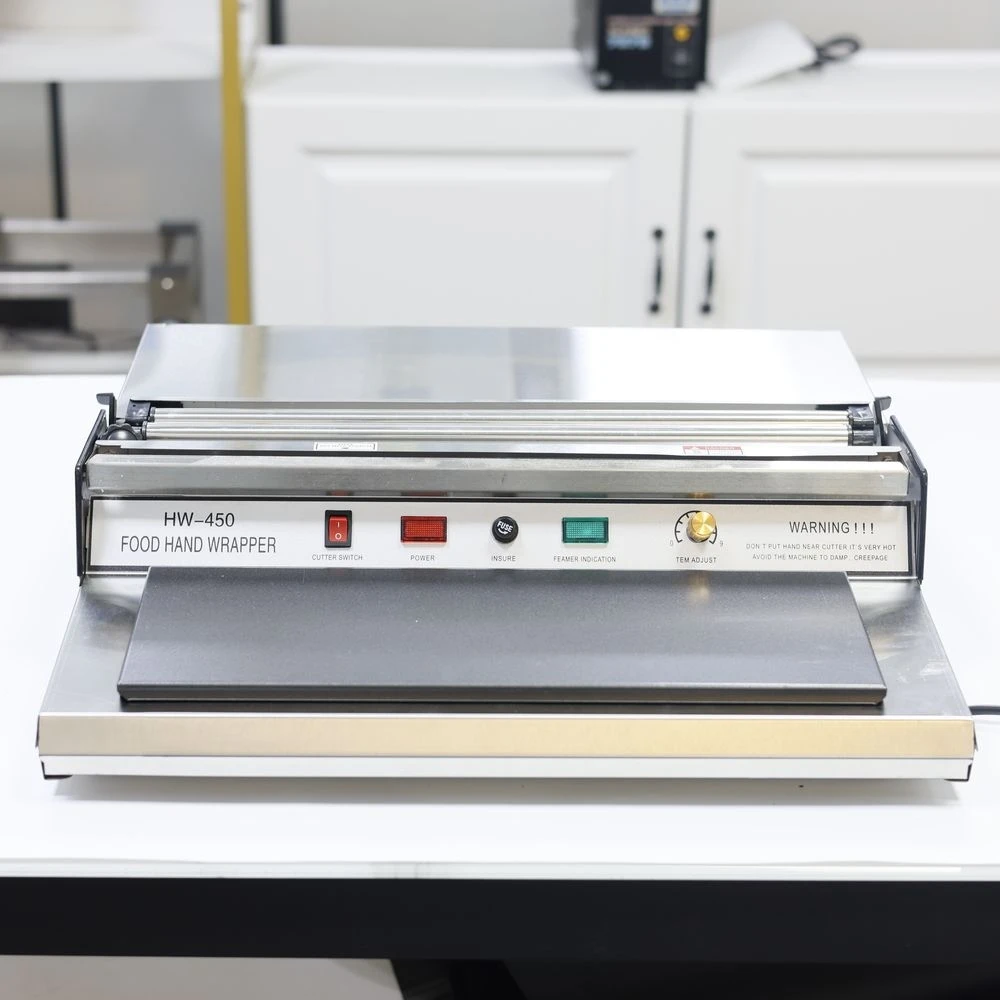 HW-450 รุ่นเครื่องห่อมือฟิล์มพลาสติกบรรจุภัณฑ์อาหารเครื่องห่อมือ