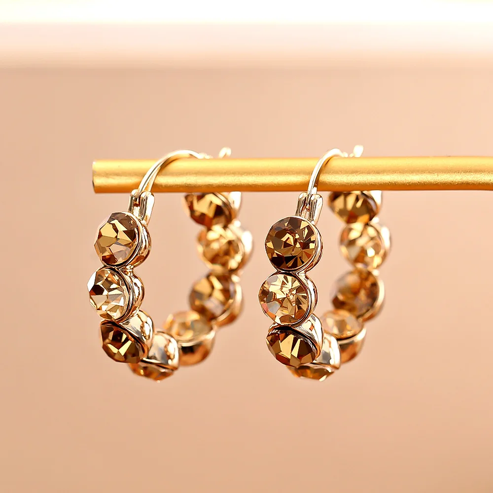 

Super sparkling champagne color zircon earrings, high-end, simple, fashionable and elegant earrings, niche design earrings