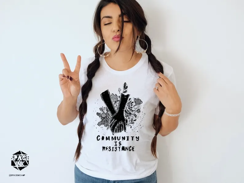 

Community is resistance t-shirt. Social justice tee, tshirt, gift idea. Screen printed
