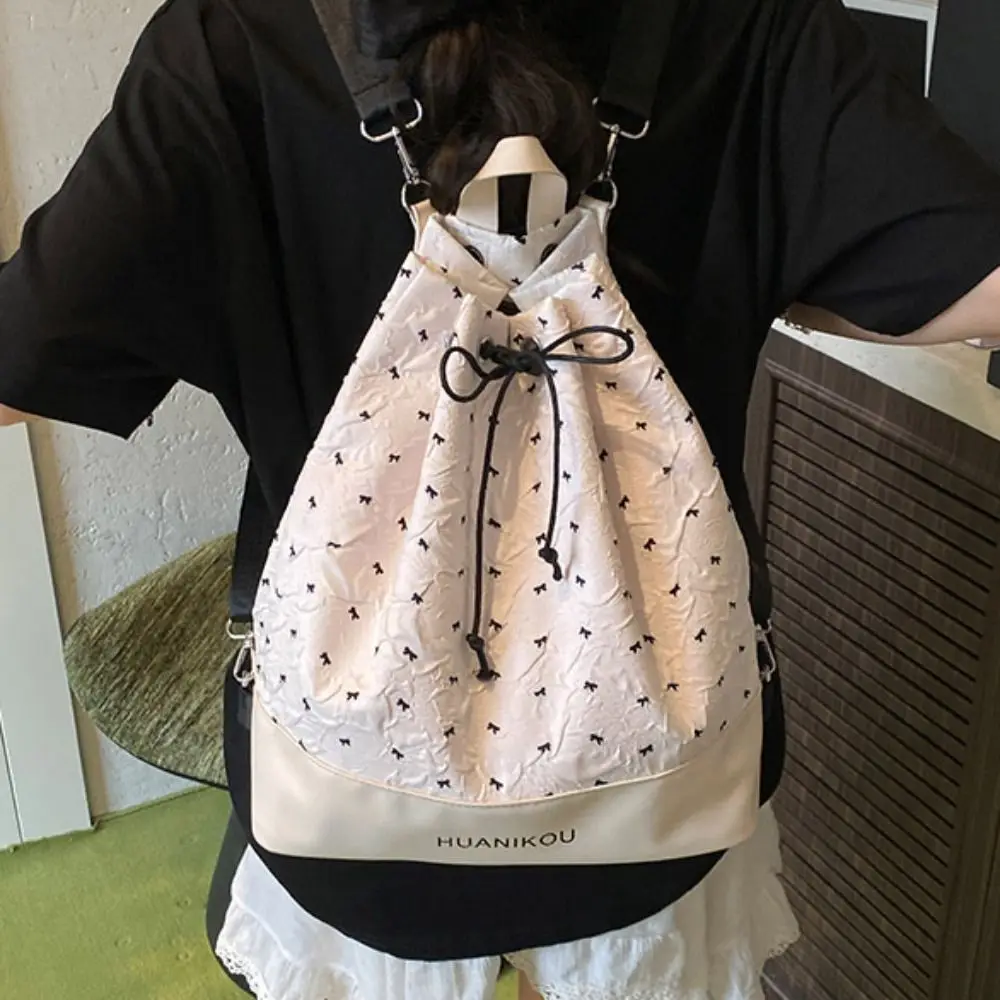 Zaino plissettato con fiocco di grande capacità Borsa a tracolla dolce leggera in tinta unita Borsa fitness da donna con coulisse in stile coreano in nylon