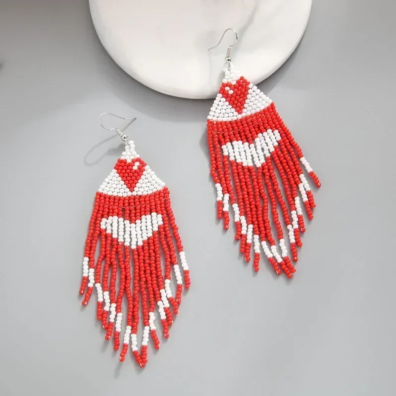 Beaded earrings Tassel Heart Originality Hand knitting Design Bohemia Alloy Female Tide Simple Rice bead earrings