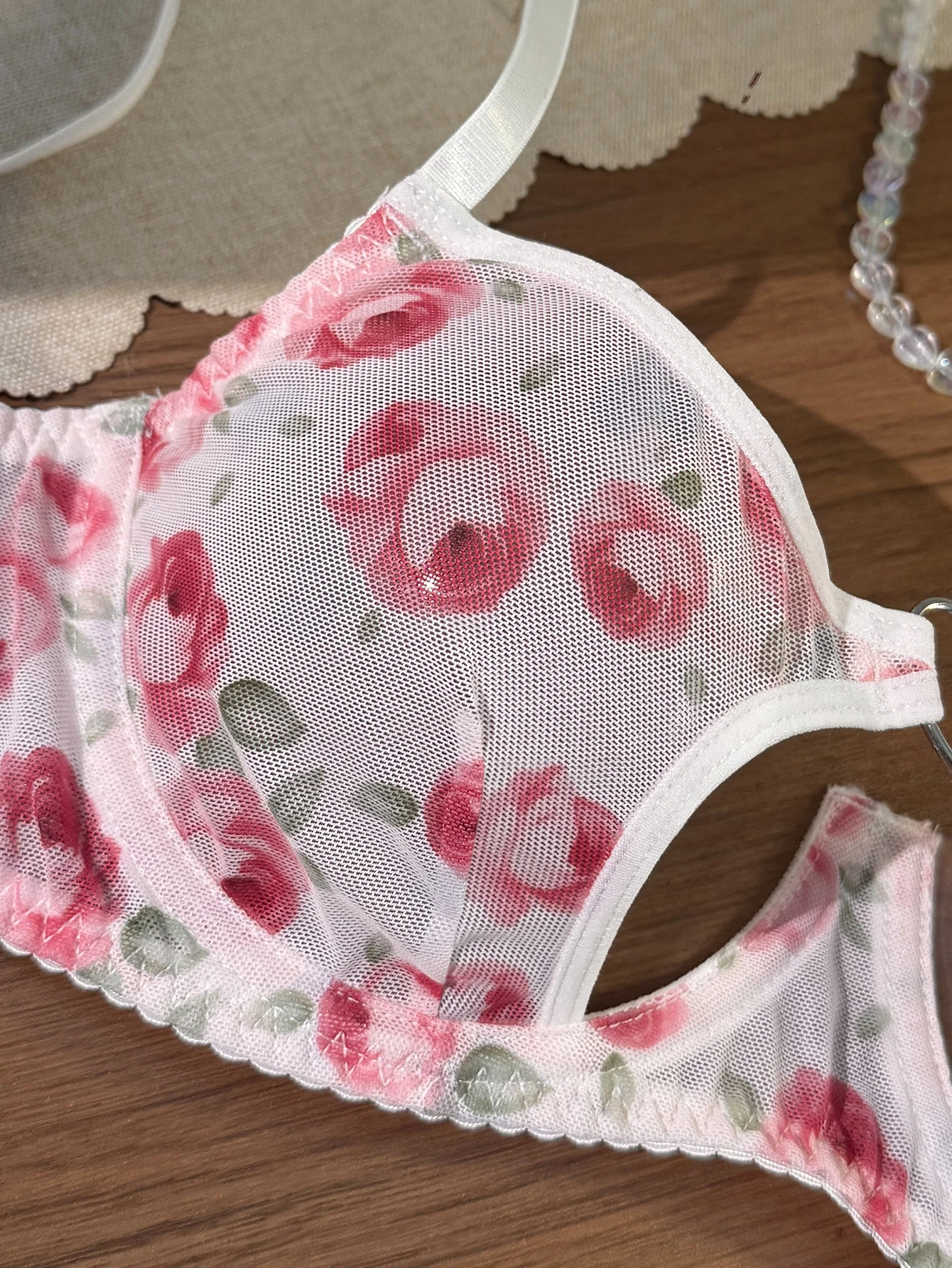 Close-up of heart cutout detail with printed mesh and feminine trim