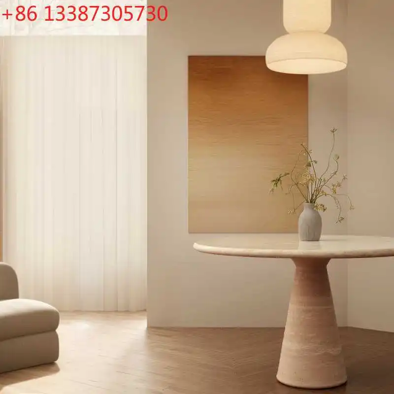 

Кофейный столик Wabi Sansi Wind из натурального травертина, круглый, кремового цвета.