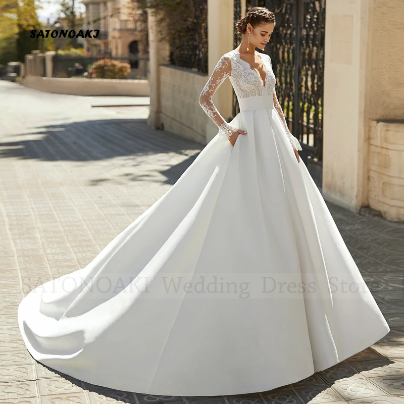 Abito da sposa elegante personalizzato in pizzo di raso Boho con tasche per le donne Manica lunga con scollo a V Sposa Abiti da sposa Robe Mariée