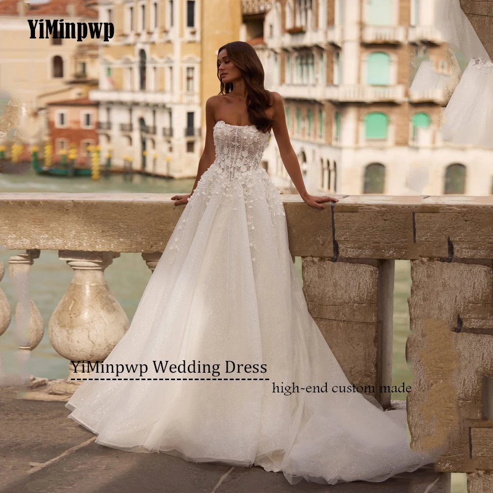 Błyszcząca suknia ślubna bez ramiączek, koronkowe aplikacje, linia A, suknie ślubne z odkrytymi ramionami, tren zamiatający, szyta na miarę 2025 Vestido De Noival