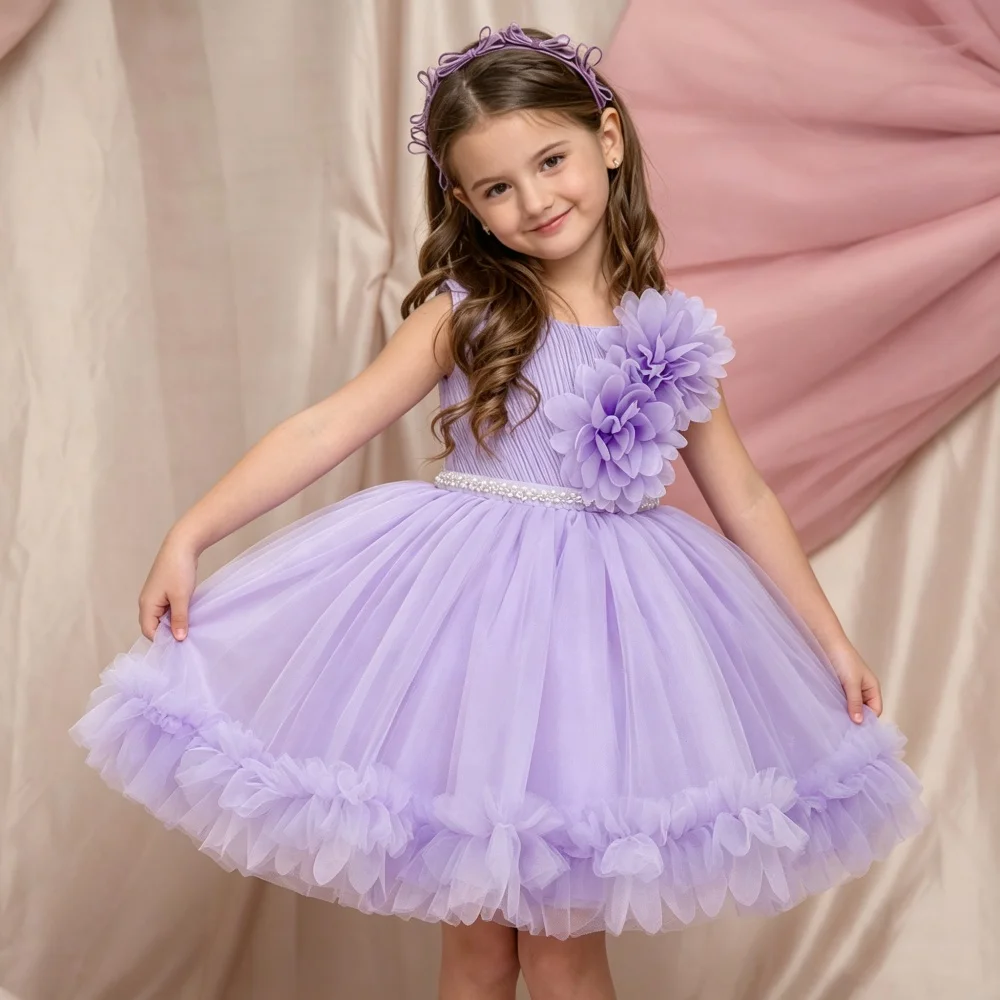 Children's formal dress featuring a bow floral accents and a voluminous tiered dress perfect for performances or evening events