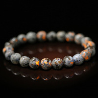 Natural Flame Stone Bead Bracelet Chakra Fire Stone Meditation Energy Wind Bracelet - Radiant under Purple Light