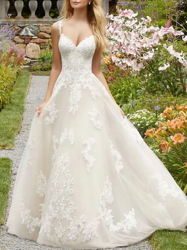 Abito da sposa romantico personalizzato Squisito pizzo Lunghezza pavimento Illusione sexy Senza spalline Corte dei treni Abito a trapezio per le donne