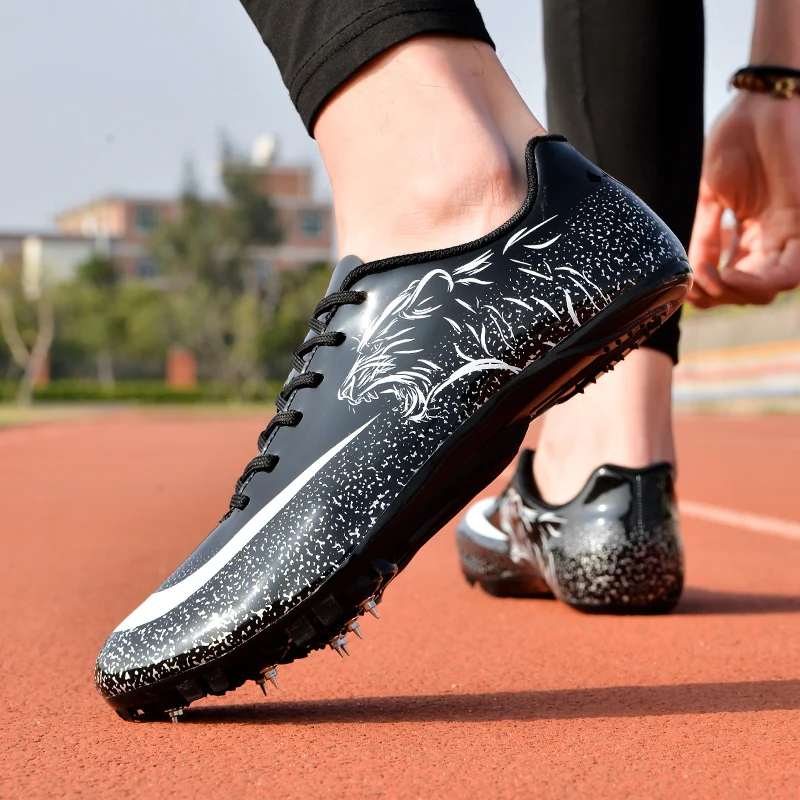 Man Track Spike Profesjonalne buty Lekkoatletyczne buty sportowe dla mężczyzn Kobiety Outdoor Kobiety Siłownia Trampki do biegania Czarny Biały