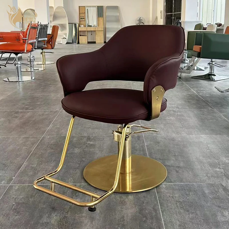 

Elegant Salon Chair With Gold Metal Base And Padded Barber Armrests