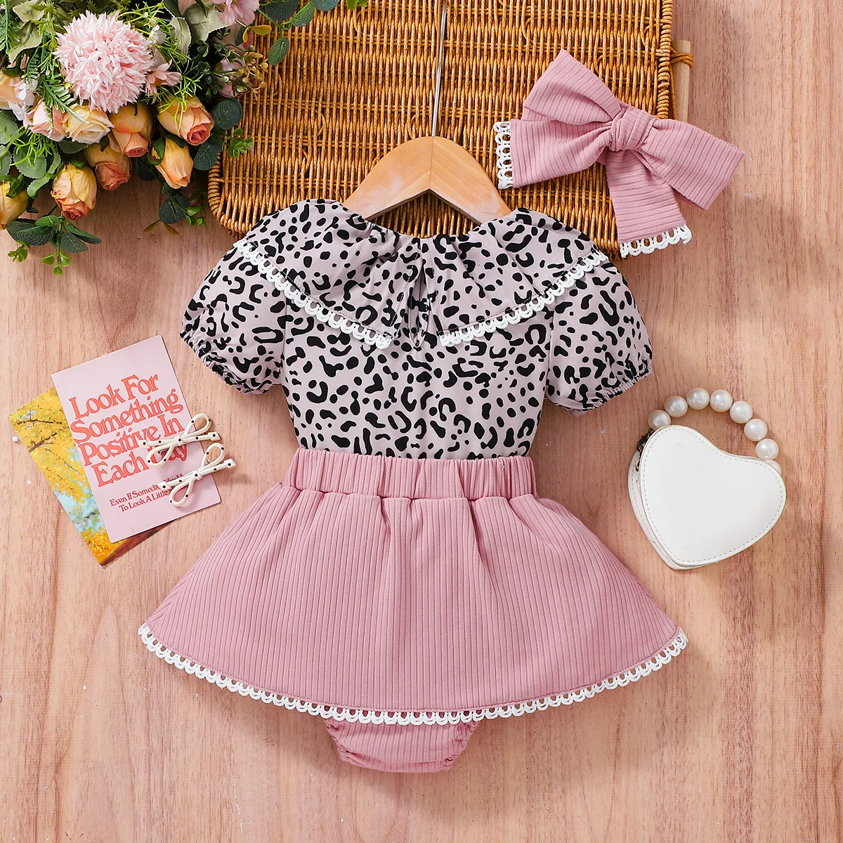 

Adorable Leopard Print Girls Outfit with Bubble Sleeve Top And Skirt with Bow Detail Matching Hair Accessories