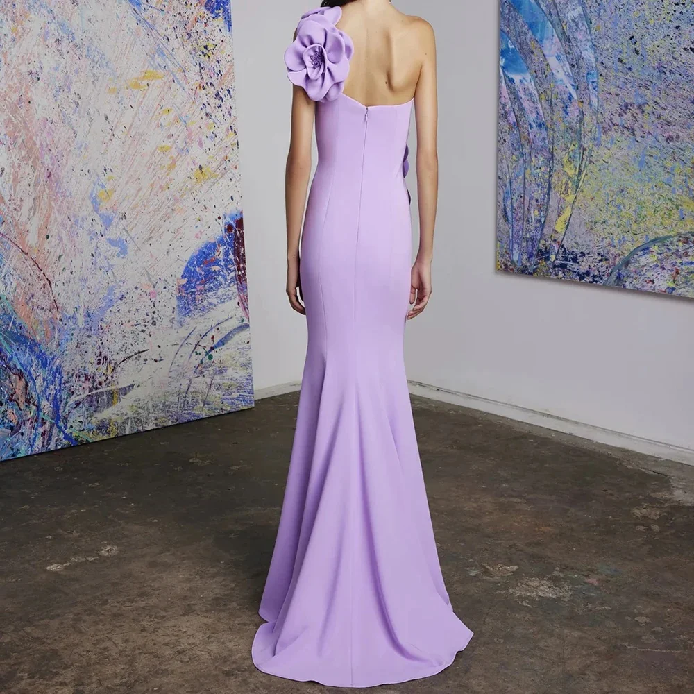 Solid color off-shoulder sleeveless fitted floor-length dress decorated with floral appliques on chest. Slanted shoulder flatter