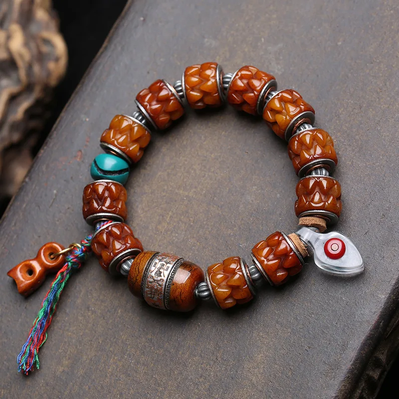Tibetan-style“reverse flow”bone and copper inlay carved“devouring collectible bracelet;single-strand yak bone amuletwith barrel