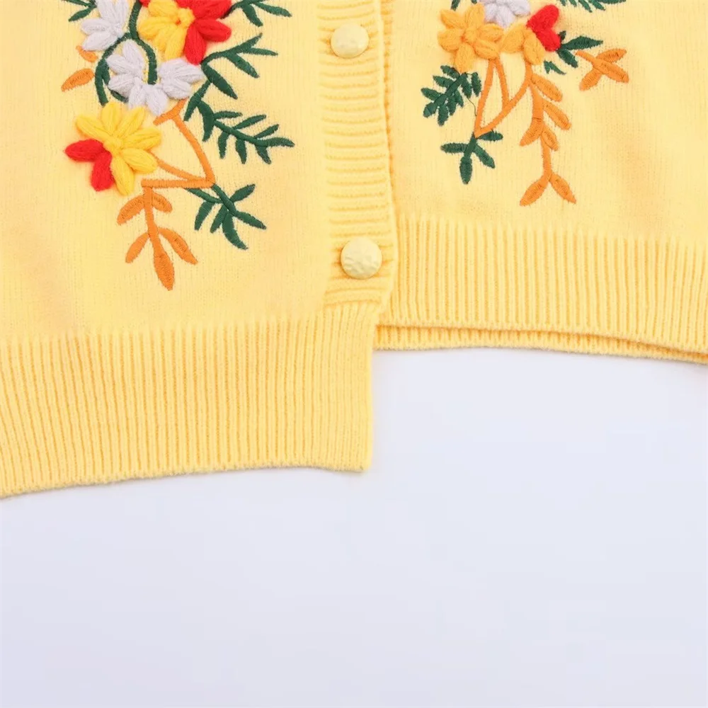 Damski jesienny nowy produkt, swobodny, uniwersalny, haftowany, asymetryczny kardigan z dzianiny z konopi, z okrągłym dekoltem.