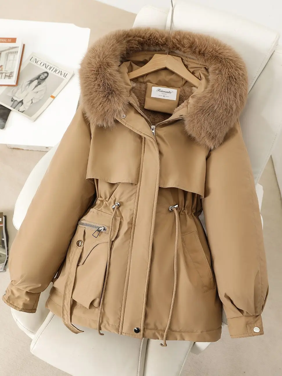 Close-up detail of leopard print application quality and faux fur trim attachment methodology at collar seam