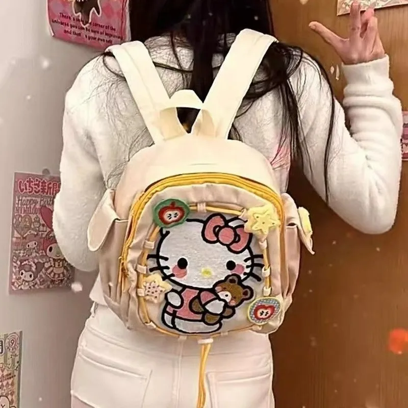 Mochila con estampado de Hello Kitty Sanrio, mochila para estudiantes a prueba de polvo, mochila de viaje multifuncional Simple, regalo de Navidad para niña