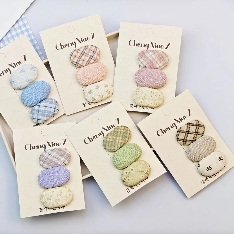 

Новинка весны 2025 года, овальные заколки BB из ткани, милые заколки в клетку с цветочным принтом, универсальные модные аксессуары для волос для маленьких девочек