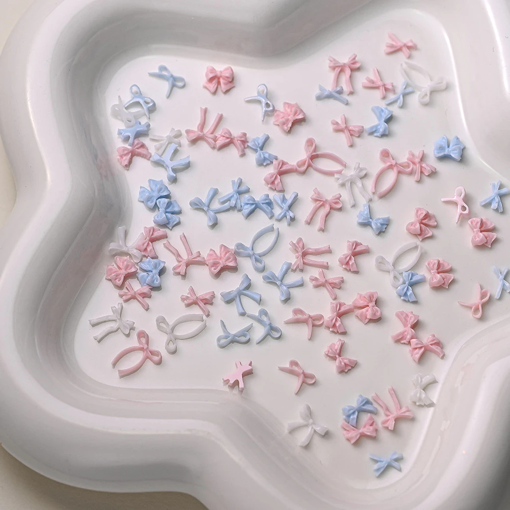ชาร์มตกแต่งเล็บรูปโบว์สีขาวสไตล์มินิมอล 3 มิติ จำนวน 100 ชิ้น โบว์ริบบิ้นมินิแบบคละแบบสำหรับตกแต่งเล็บ DIY งานฝีมือ ชิ้นส่วนสำหรับทำเล็บ