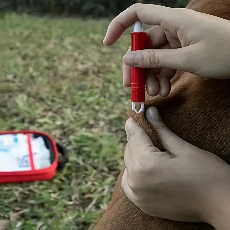 A comprehensive pet first aid kit with scissors, tweezers, tourniquets, sterile gauze and other medical and first aid supplies