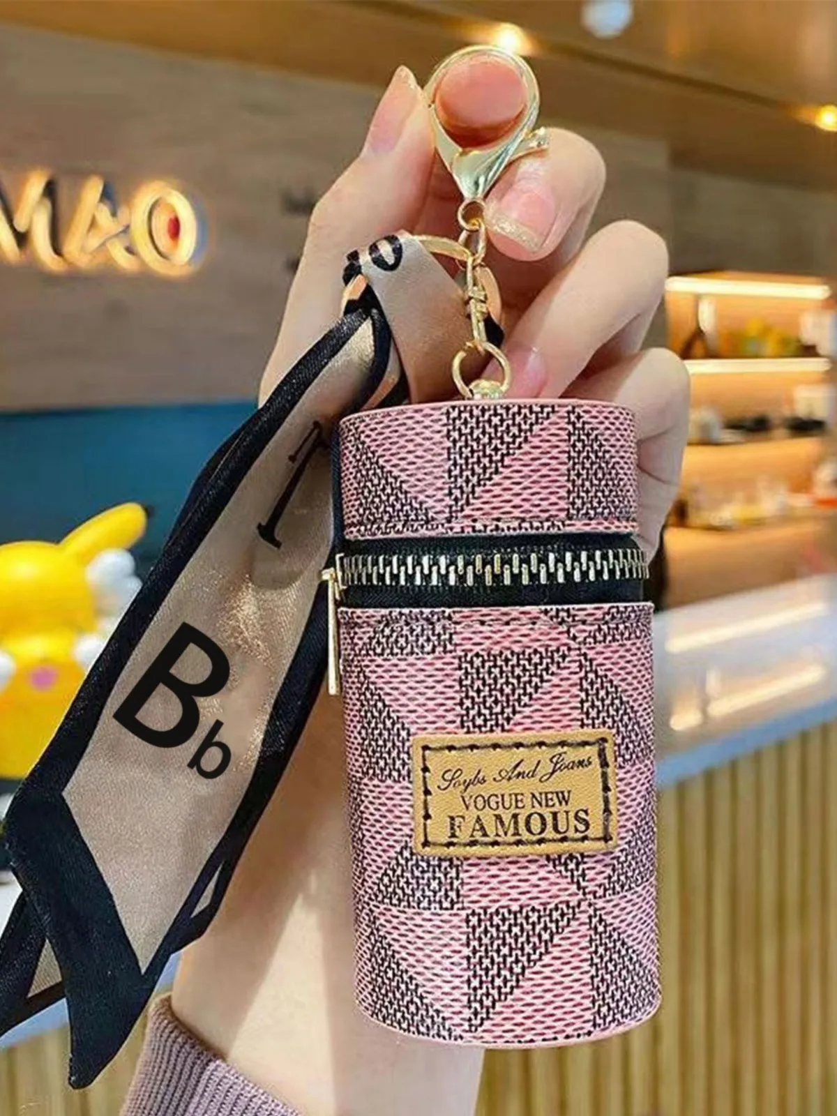 Mini monedero con lápiz labial, Bolso pequeño con colgante para auriculares, llavero, moda europea y americana, novedad