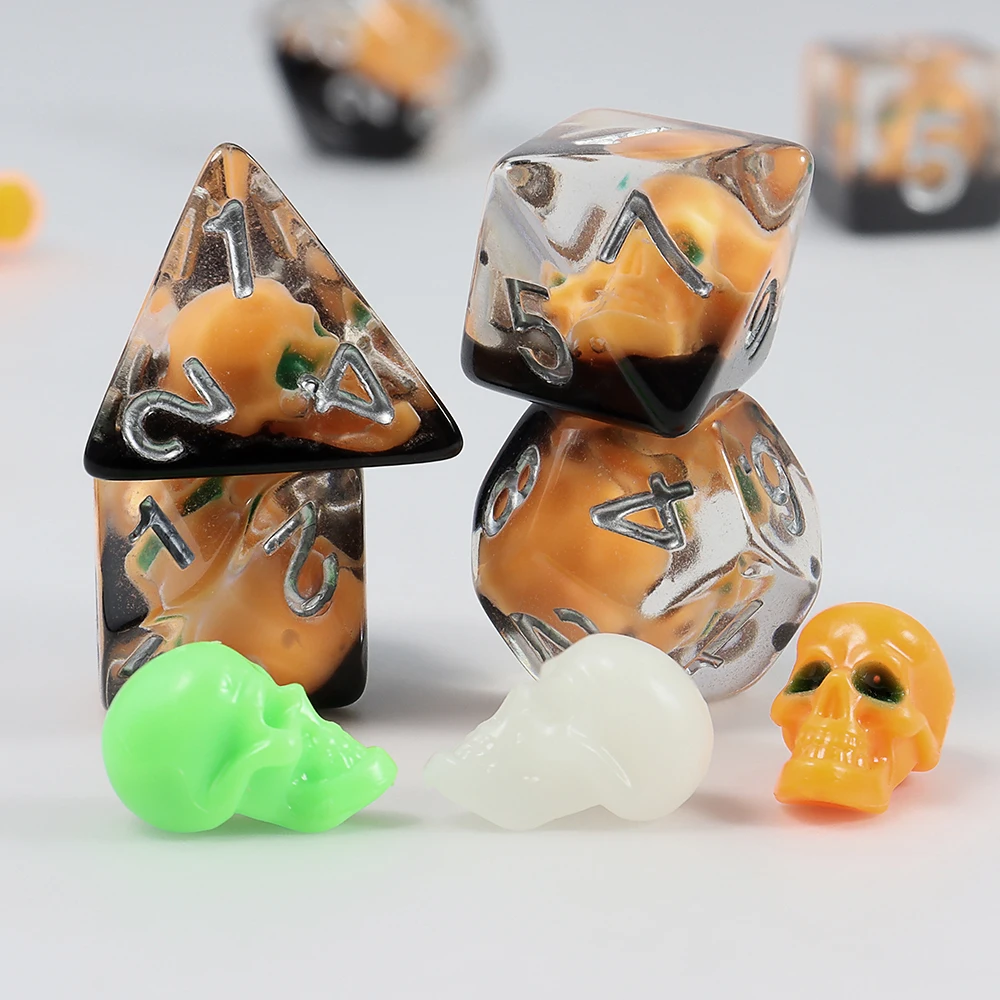 A Set of Pumpkin-Colored Skull Core-Spun Resin Dice, Halloween Multi-Element Ensemble Dice, Various Game Accessories and Supplies