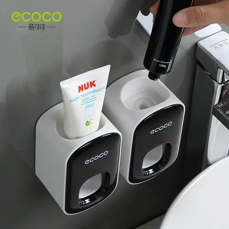 ECOCO Fully automatic toothpaste squeezing suction wall mounted squeezer for household non perforated toothbrush storage rack