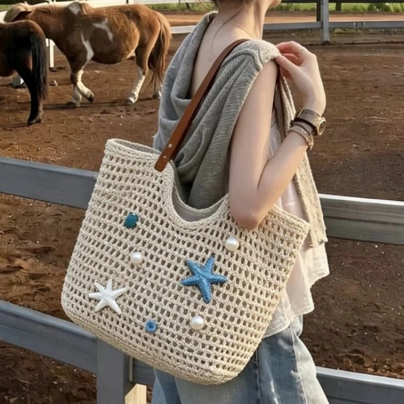 

Summer niche hollow bag women's 2026 new seaside vacation beach bags large capacity shoulder package woven pack