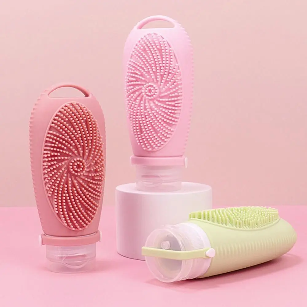 Przenośna butelka z szczotką pod prysznic 2 w 1 Silikonowe butelki podróżne 100 ml z możliwością wielokrotnego napełniania Wyciskane, szczelne pojemniki na przybory toaletowe