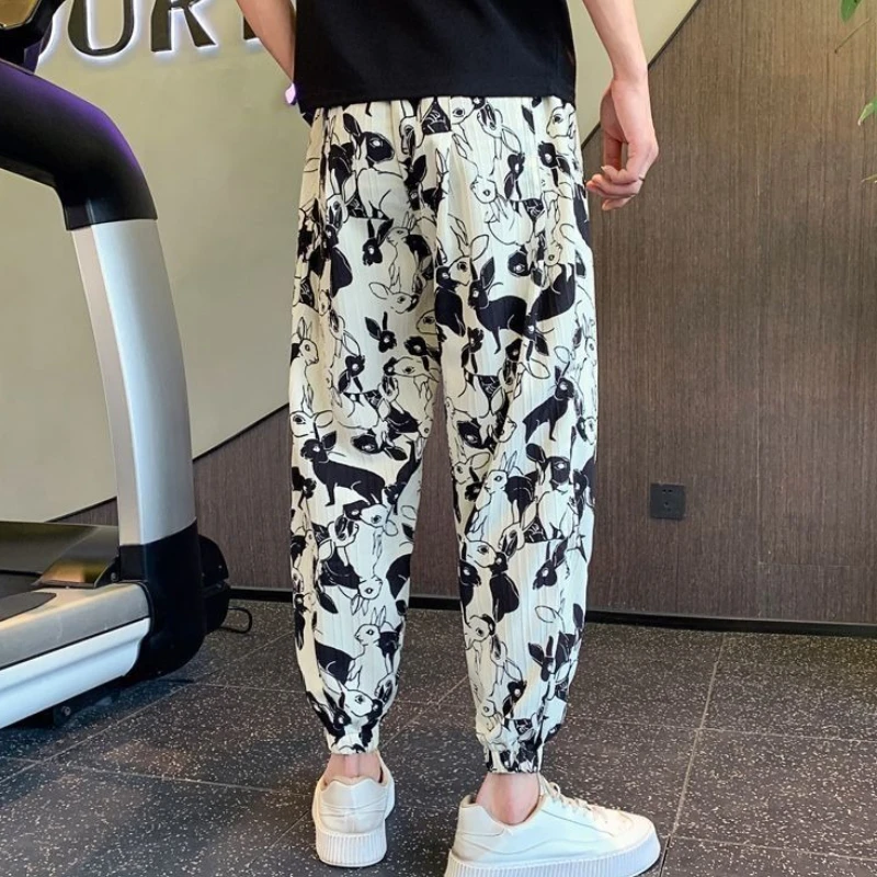 Летние тонкие мужские укороченные брюки из ледяного шелка с принтом, свободные мужские повседневные шаровары, большой размер, дизайнерская оригинальная одежда, дешевые брюки