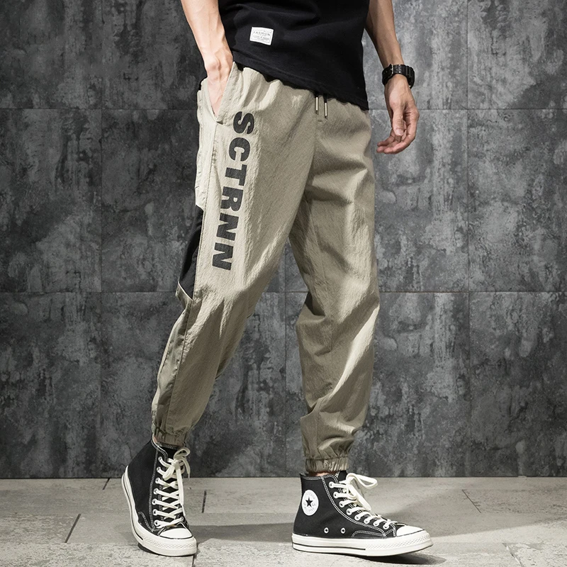 

Модные летние свободные брюки больших размеров из ледяного шелка, тонкие спортивные повседневные брюки с девятью точками для мужчин, модные универсальные брюки Harlan Tro...