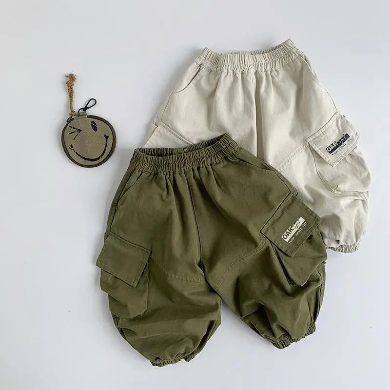 

2025 Spring New Children Loose Pocket Trousers Solid Boys Versatile Cargo Pants Baby Girls Casual Pants Cotton Kids Clothes