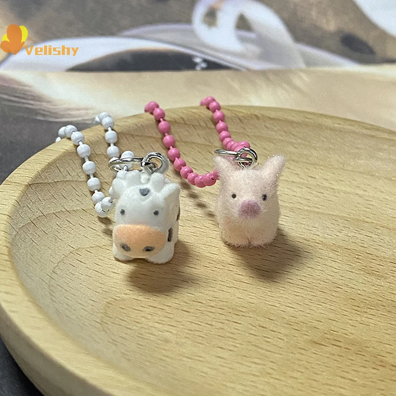 ثلاثية الأبعاد يتدفقون الحيوان سلسلة مفاتيح قصيرة صغيرة الراتنج رقيق كيرينغ حقيبة أنيقة قلادة حقيبة سماعة الاذن سحر حامل مفتاح السيارة زوجين الهدايا