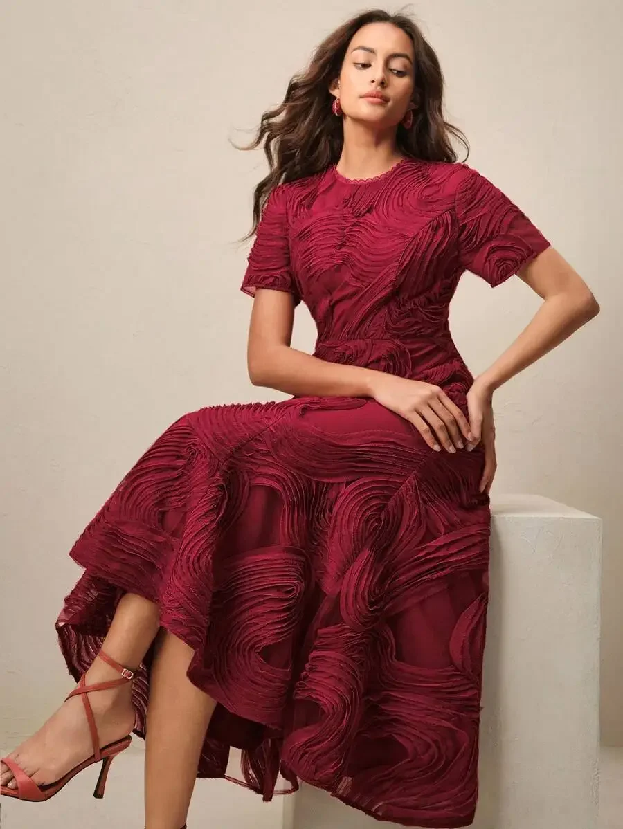 

Elegant Burgundy Midi Dress With Short Sleeves, 3D Swirl Texture, And Asymmetrical Ruffled Hem For Special Occasions