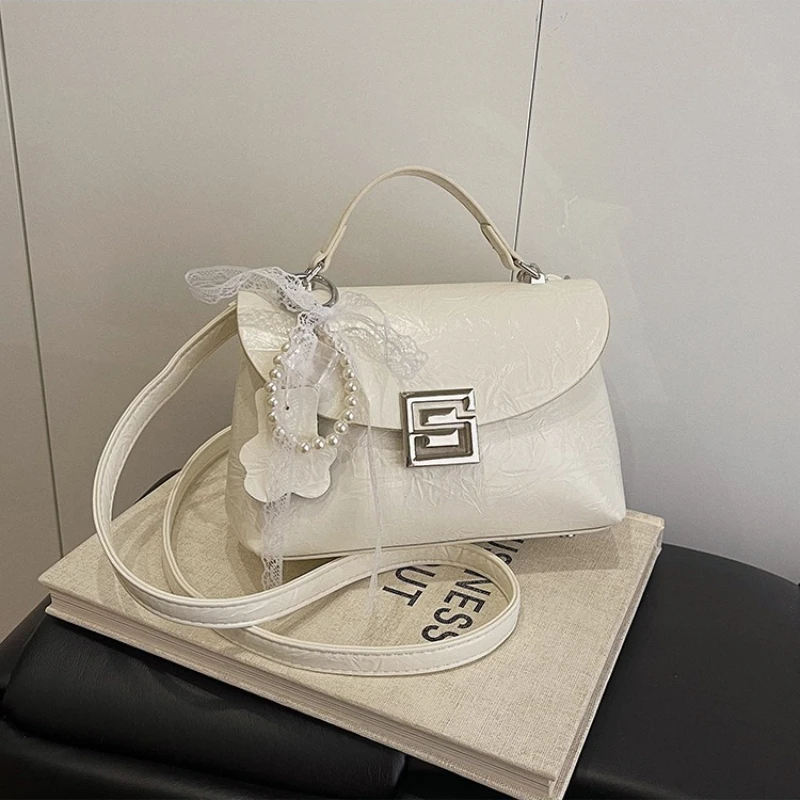 

Minimalist High-End Diaper Bag: Elegant Crossbody Handbag For Women With Designer Logo And Large Capacity Vintage Leather Tote