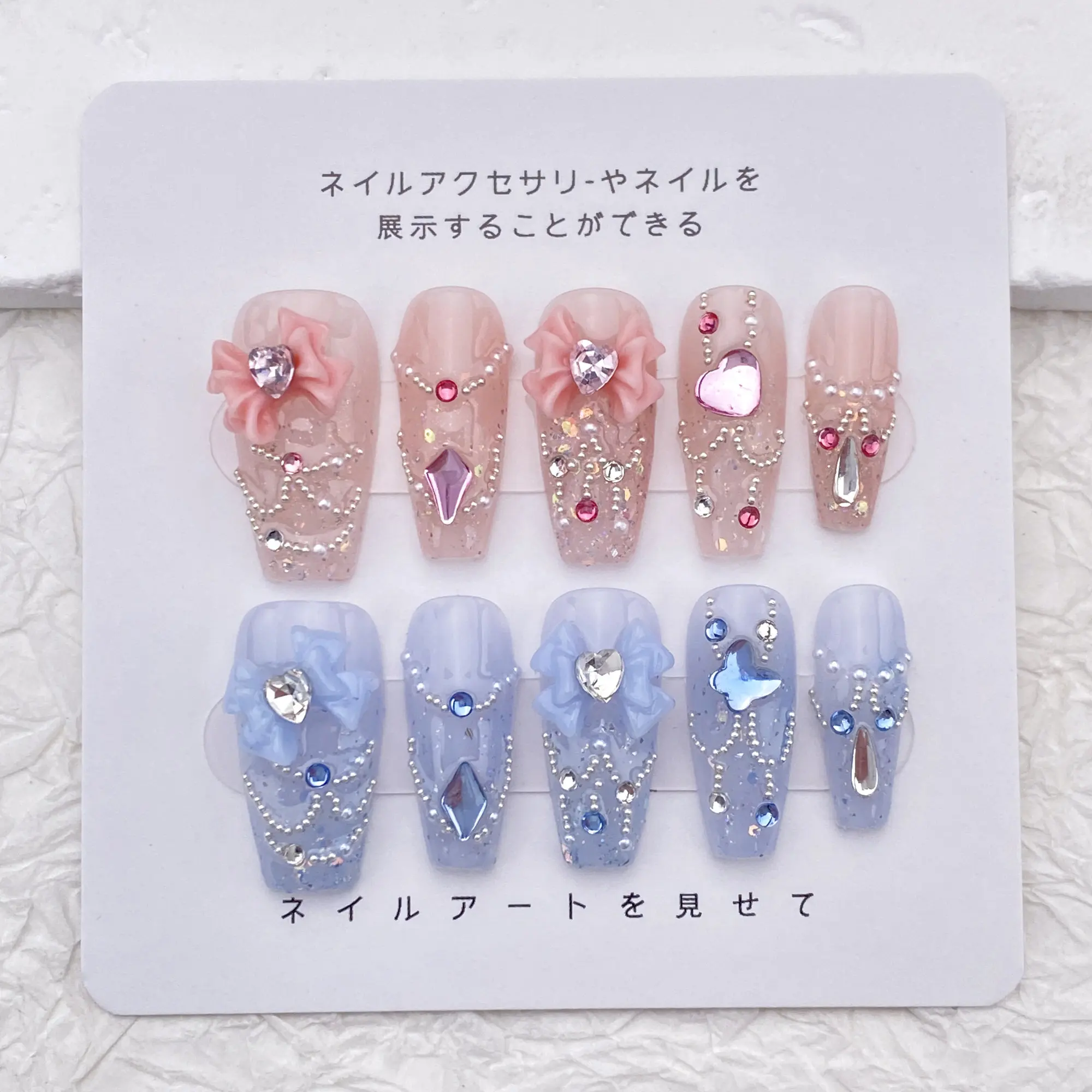 

Gradient pink crystal bow design fake nails hand-pressed on the nails mid-length wearing nails