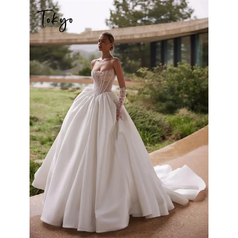

Tokyo Beaded Corset Strapless Neckline Wedding Dress Sheer Lace Voluminous Skirt Ball Gown Style Royal Aesthetic Bridal Gown