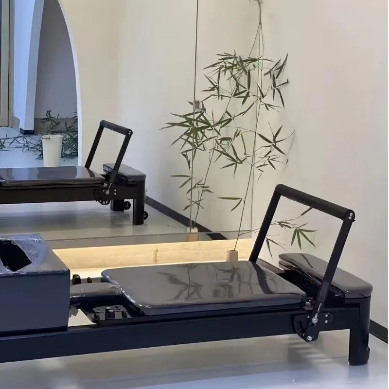 

High-quality exercise machine studio using core training aluminum Pilates reformer with wood components
