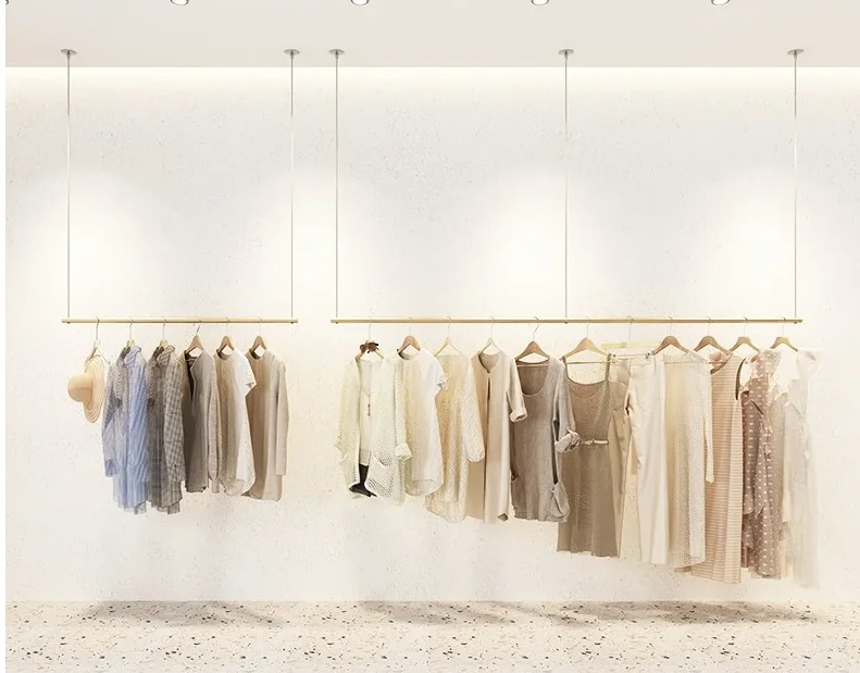 Clothes store display rack Gold display rack Hanging clothes hanger on the wall