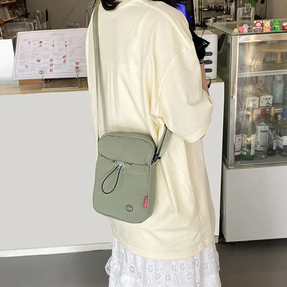 

Solid Color Drawstring Crossbody Bag Korean style Nylon Water Bottle Carrier Bag Lightweight Waterproof Mobile Phone Bag